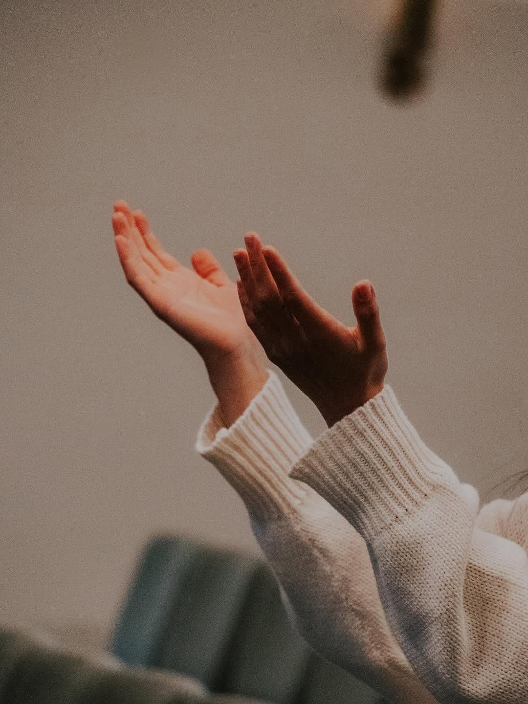 Hands raised in worship at 1128 Ministry