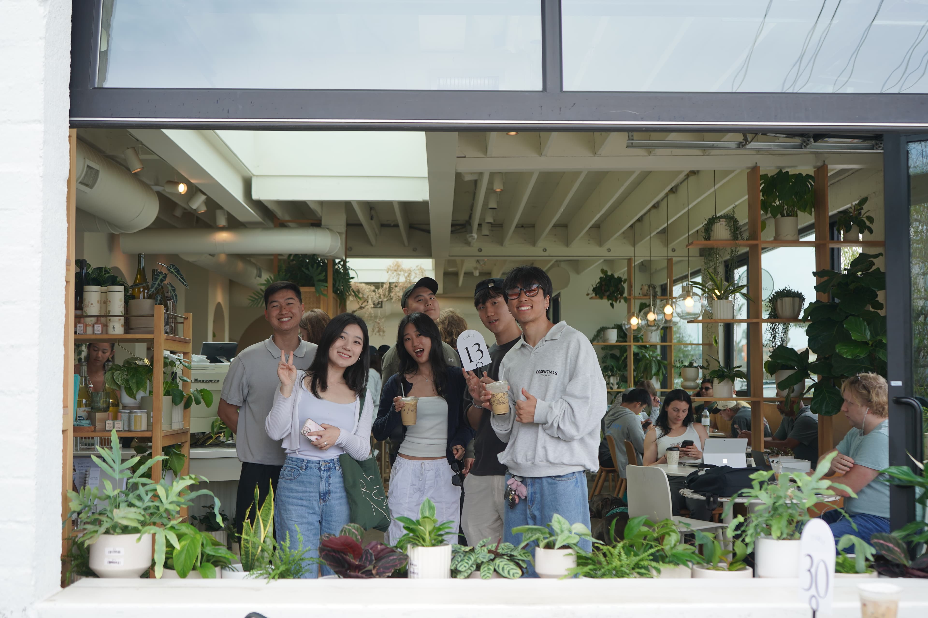 1128 friends smiling together at a café