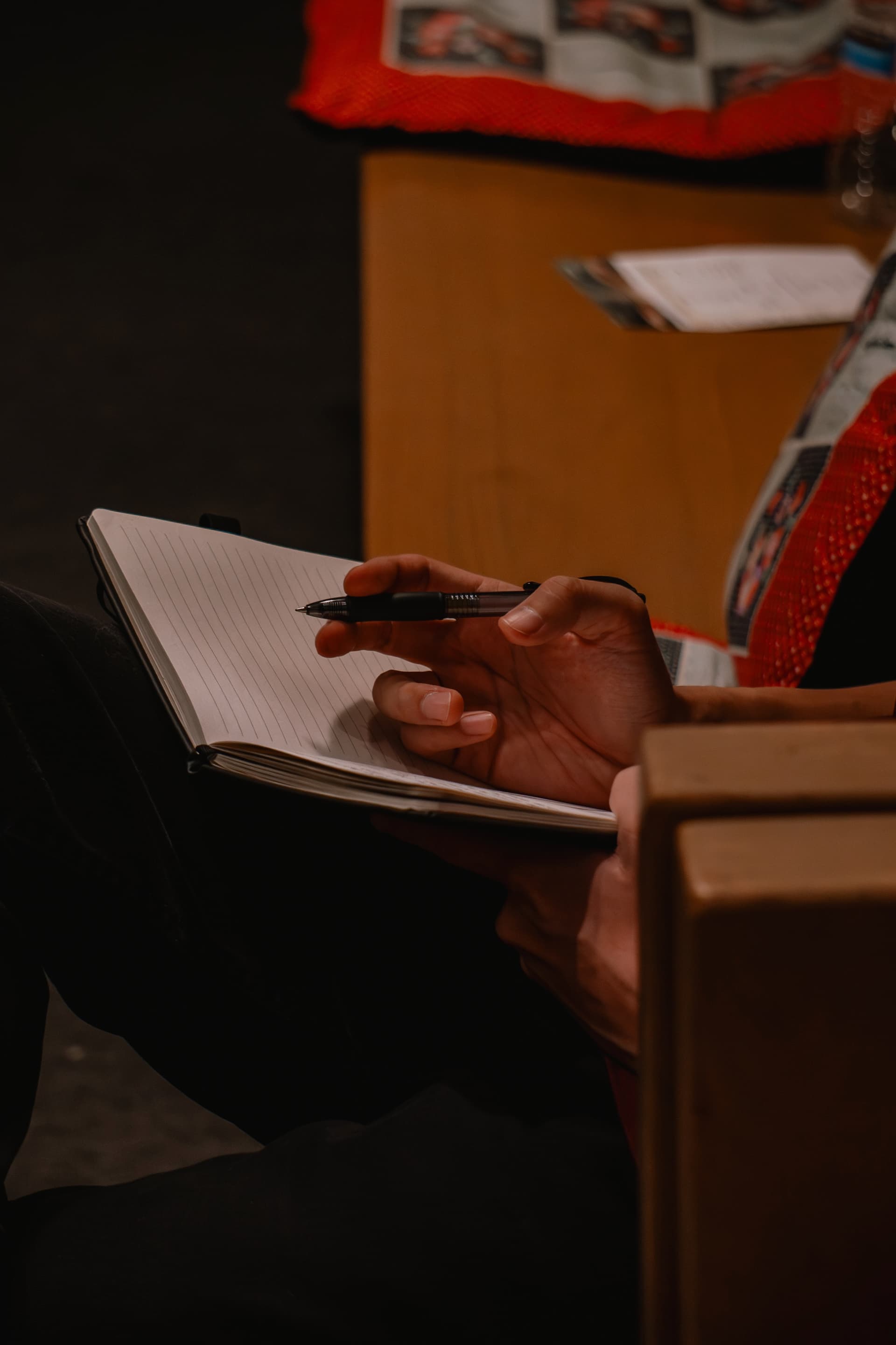 Taking notes during a sermon at 1128 Ministry