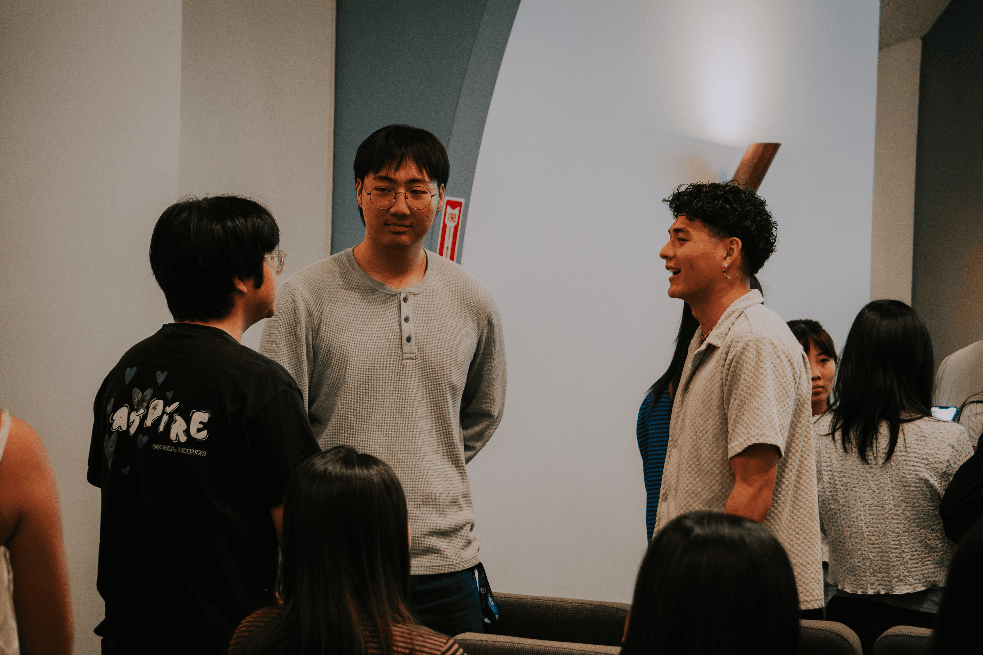 Friends catching up and laughing at a church gathering